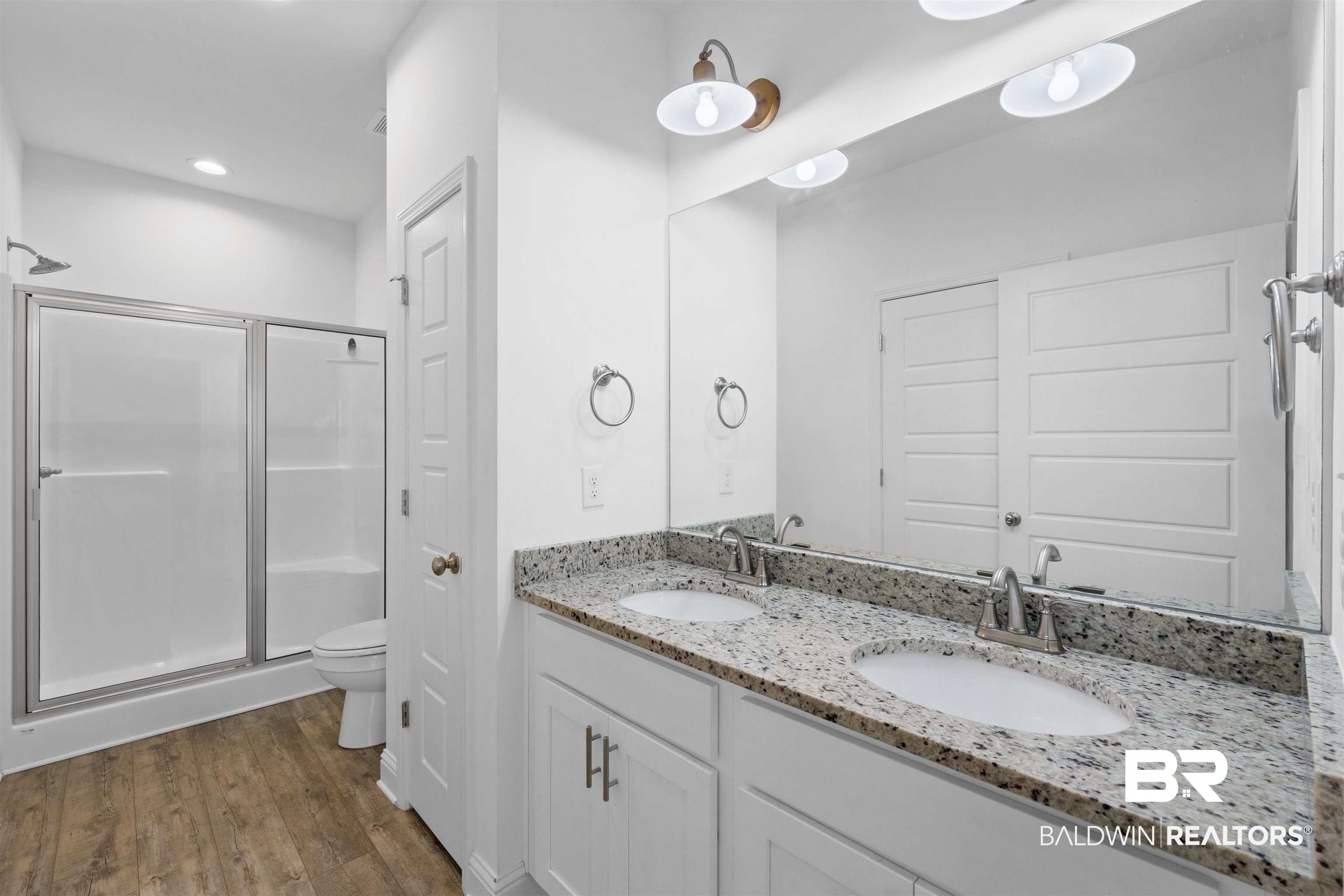 2651 South Juniper Street, Unit 1801 Foley, AL 36535 - Photo 13 of 16 Dual vanity with light-toned granite-style countertop and integrated sinks
