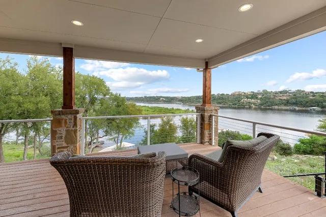 a balcony with furniture and wooden floor