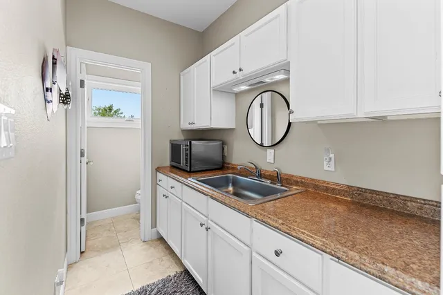 a kitchen with a sink and cabinets
