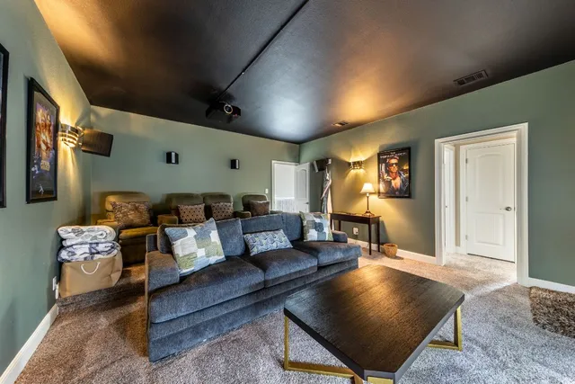 a living room with furniture rug and window