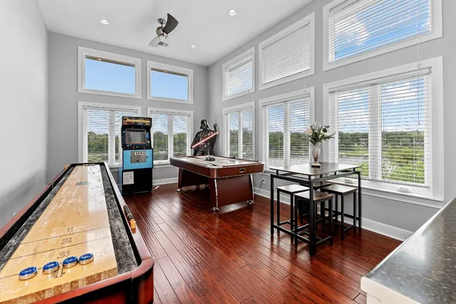 a living room with fireplace furniture and a wooden floor