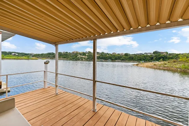 a view of a balcony with wooden floor