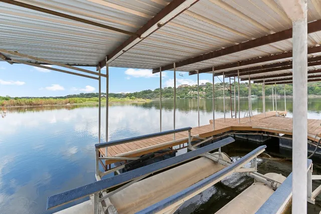 a sitting area with pool table and chairs
