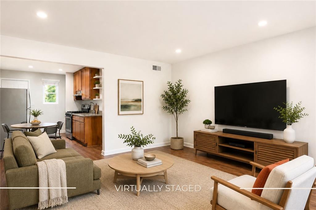 3203 East Point Street, Unit 4 Atlanta, GA 30344 - Photo 2 of 18 a living room with furniture and a flat screen tv