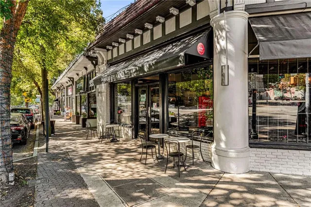 a view of a building with sitting area
