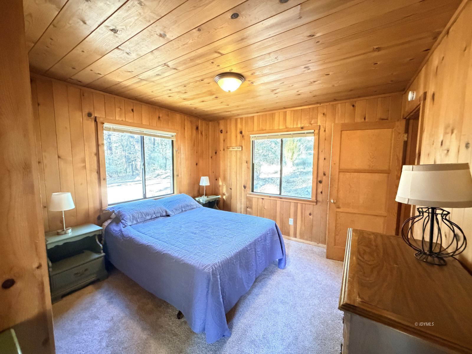 54059 Montgomery Idyllwild, CA 92549 - Photo 11 of 24 a bedroom with a bed a table and flat screen tv