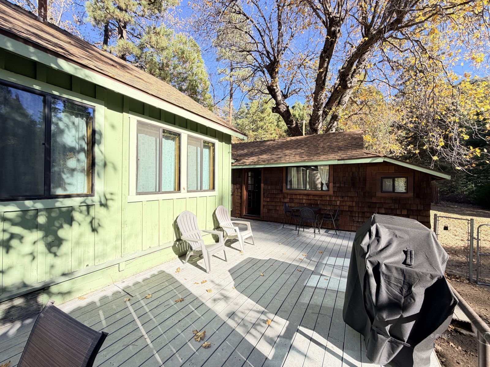 54059 Montgomery Idyllwild, CA 92549 - Photo 20 of 24 a view of balcony with two chairs and a barbeque