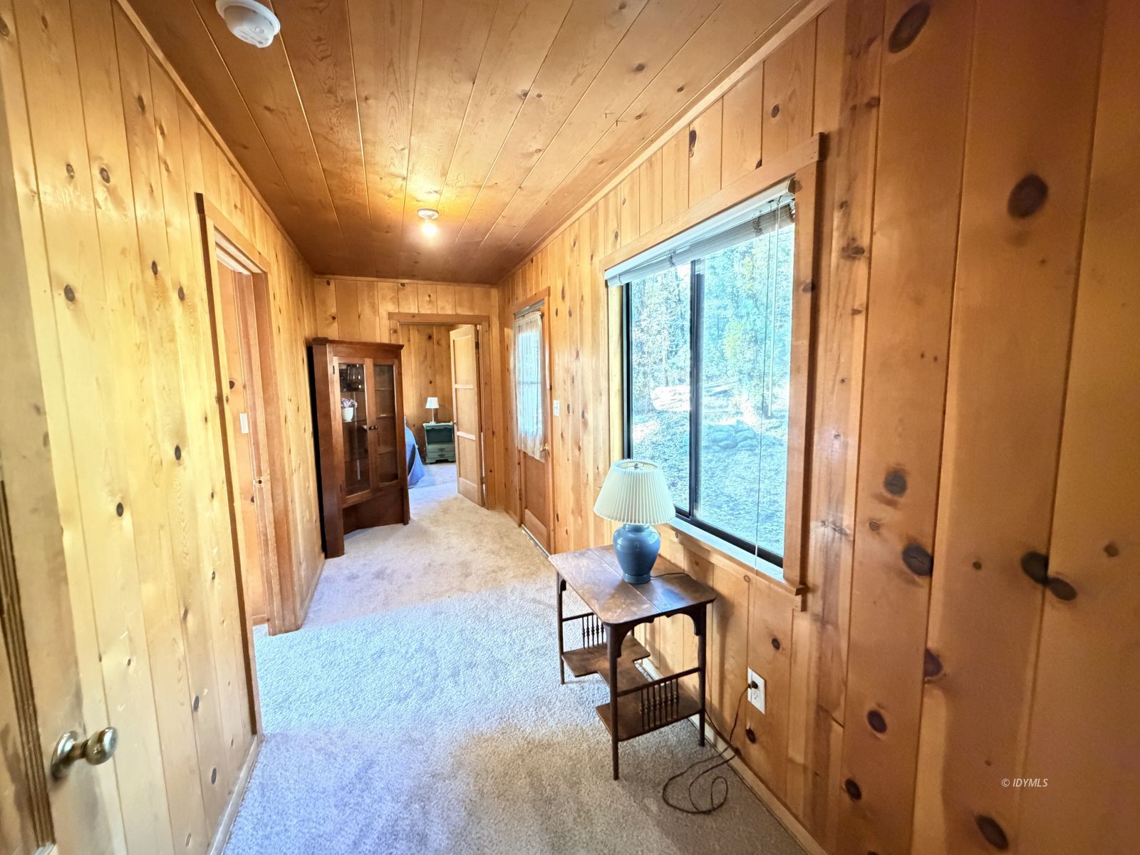 54059 Montgomery Idyllwild, CA 92549 - Photo 7 of 24 a view of a hallway with furniture and a window
