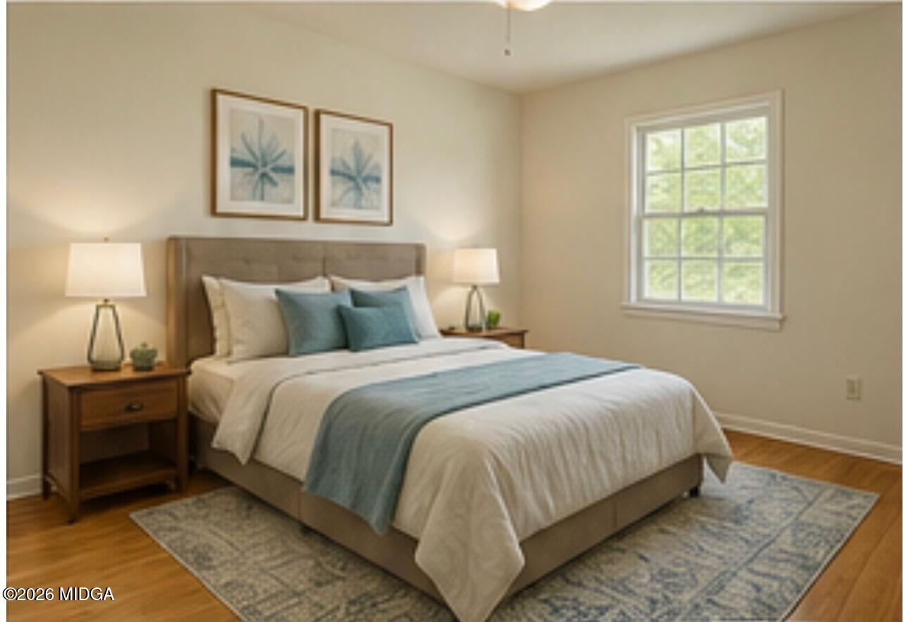 1624 Randall Road Macon, GA 31206 - Photo 4 of 5 a bedroom with a bed and a night stand