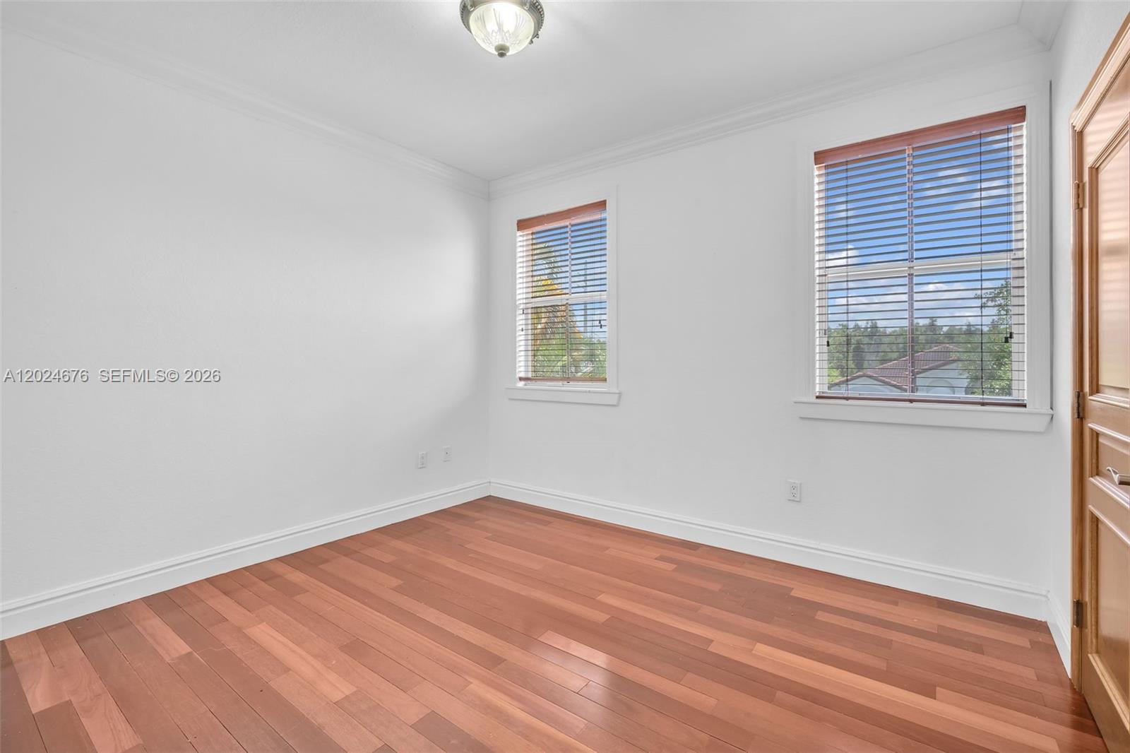 2155 Southwest 156th Court Miami, FL 33185 - Photo 33 of 57 wooden floor in an empty room with a window