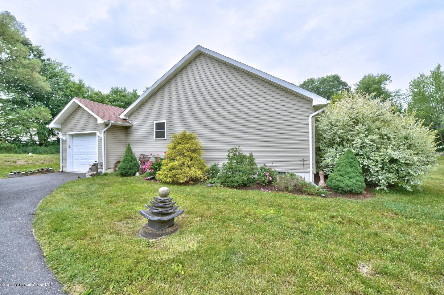 274 Trenton Lakewood Road Cream Ridge, NJ 08514 - Photo 2 of 31 a front view of a house with a yard and garage