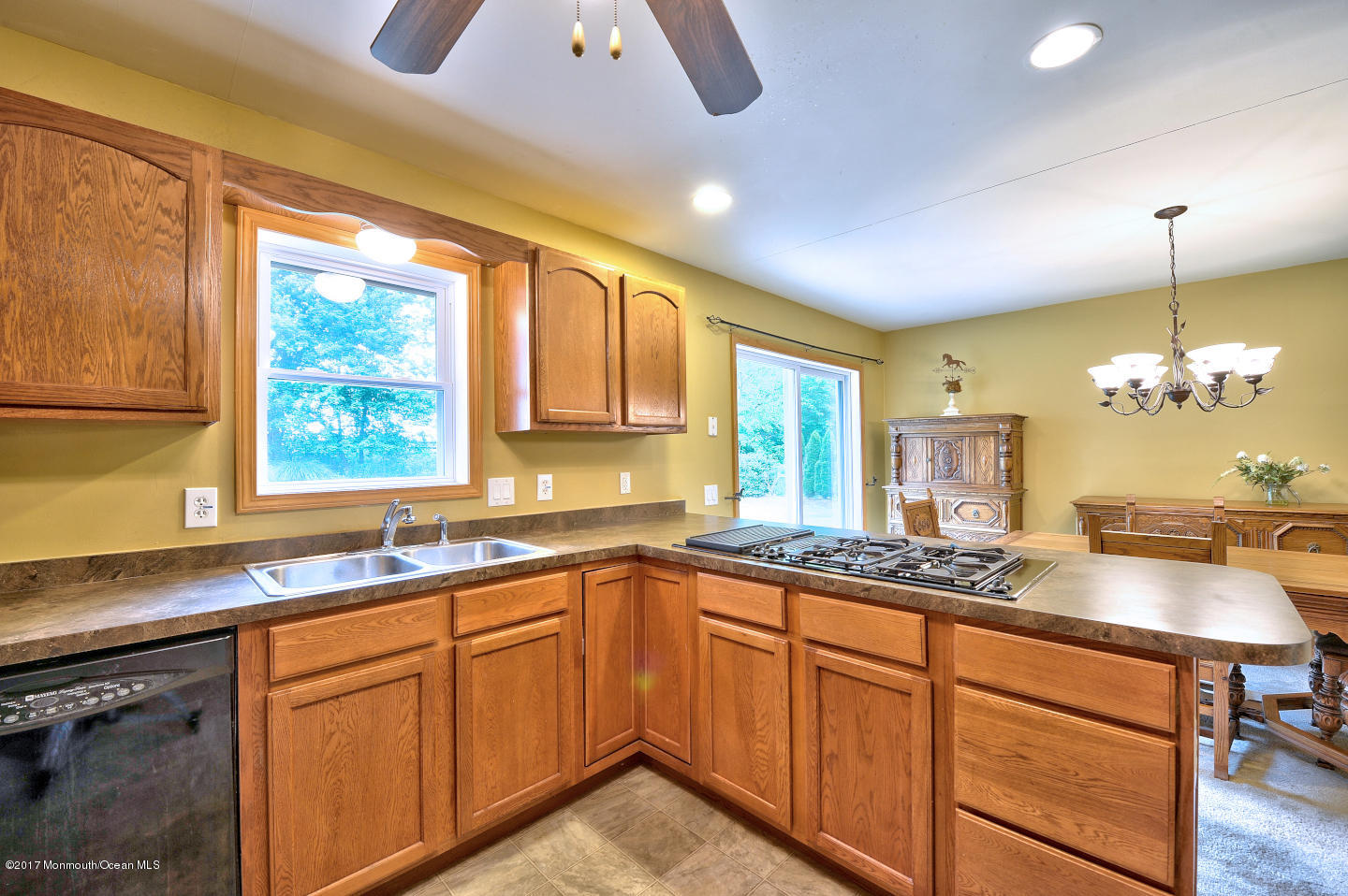 274 Trenton Lakewood Road Cream Ridge, NJ 08514 - Photo 14 of 31 a kitchen with granite countertop sink stove and cabinets