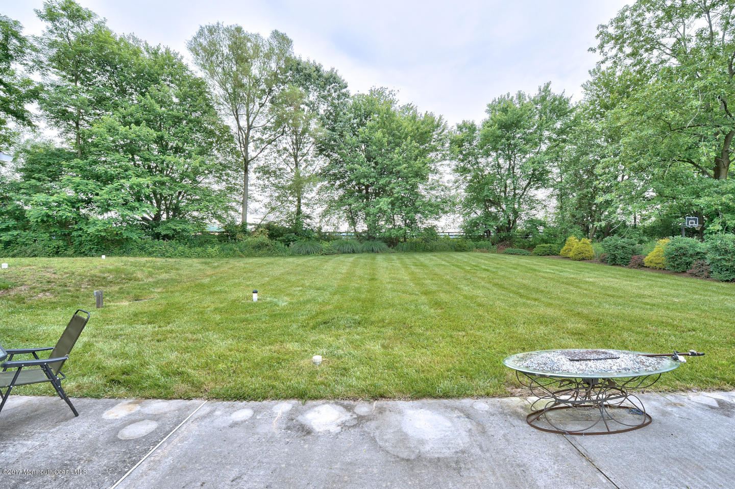 274 Trenton Lakewood Road Cream Ridge, NJ 08514 - Photo 3 of 31 a view of a backyard with table and chairs potted plants and large tree