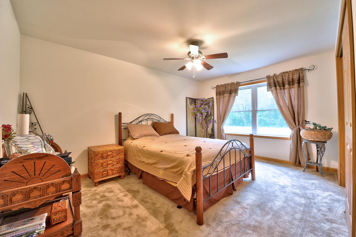 274 Trenton Lakewood Road Cream Ridge, NJ 08514 - Photo 24 of 31 a bed room with a bed and a chair