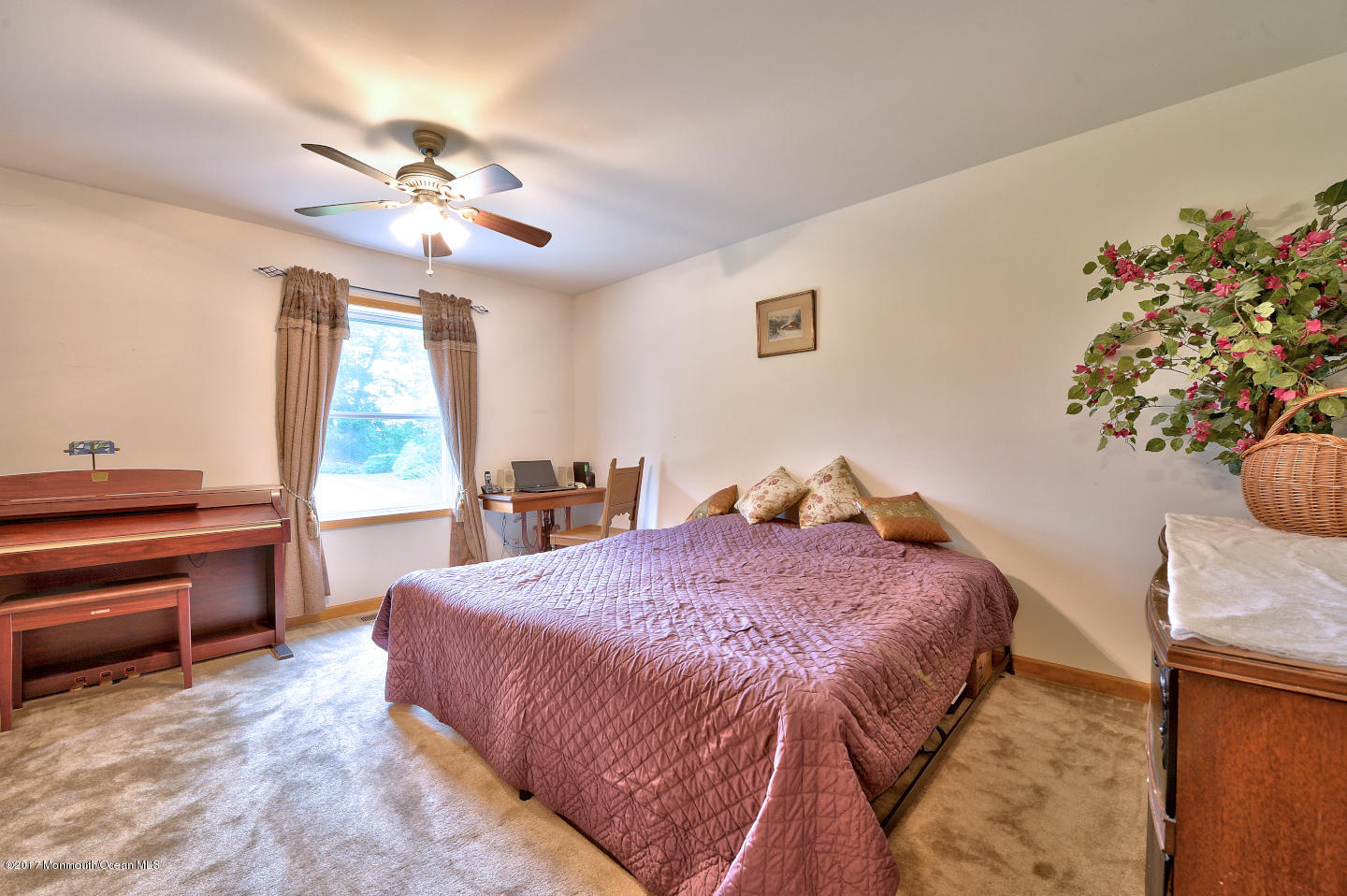 274 Trenton Lakewood Road Cream Ridge, NJ 08514 - Photo 27 of 31 a spacious bedroom with a bed and a chandelier