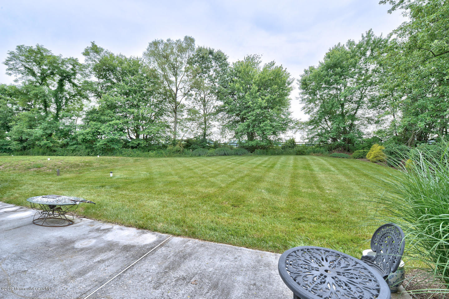 274 Trenton Lakewood Road Cream Ridge, NJ 08514 - Photo 4 of 31 a view of a swimming pool and a yard
