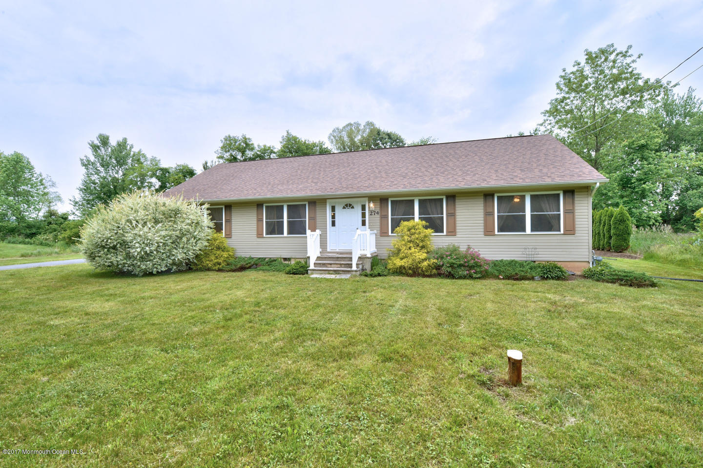 274 Trenton Lakewood Road Cream Ridge, NJ 08514 - Photo 31 of 31 a front view of a house with a yard