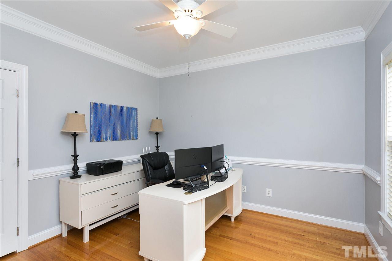 1813 Foxbrook Drive Raleigh, NC 27603 - Photo 3 of 23 Features crown molding and chair railing.