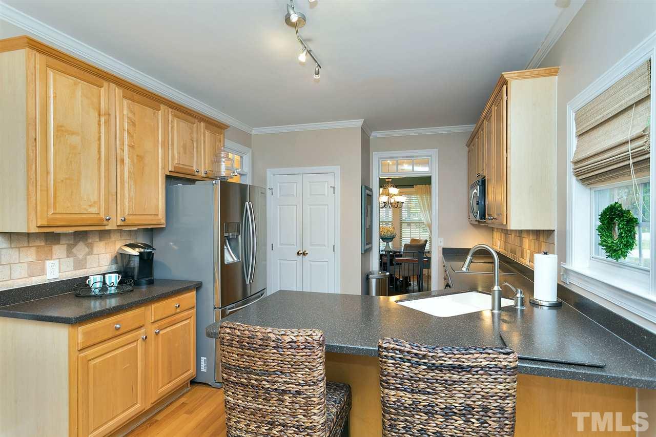 1813 Foxbrook Drive Raleigh, NC 27603 - Photo 8 of 23 Eat at bar area, abundance of cabinets and counter space.