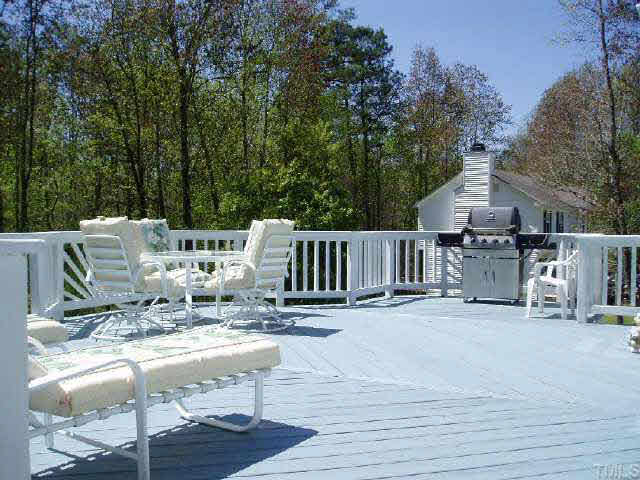 612 Trunecek Circle Raleigh, NC 27603 - Photo 6 of 9 a view of a patio with table and chairs and wooden floor