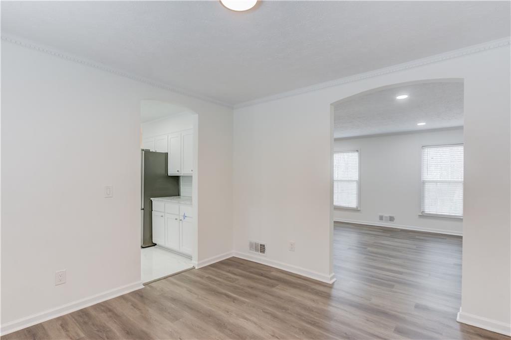 313 Summit Ridge Drive Lawrenceville, GA 30046 - Photo 11 of 42 wooden floor in an empty room with a window