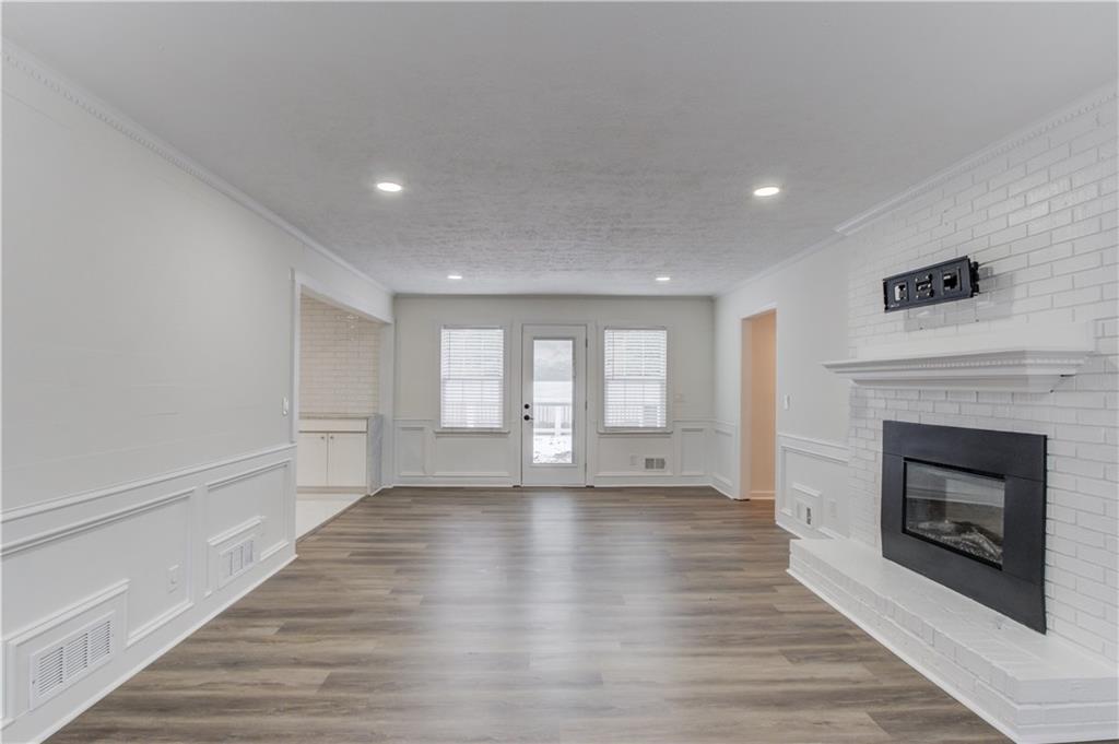 313 Summit Ridge Drive Lawrenceville, GA 30046 - Photo 12 of 42 a view of an empty room with a fireplace and a window