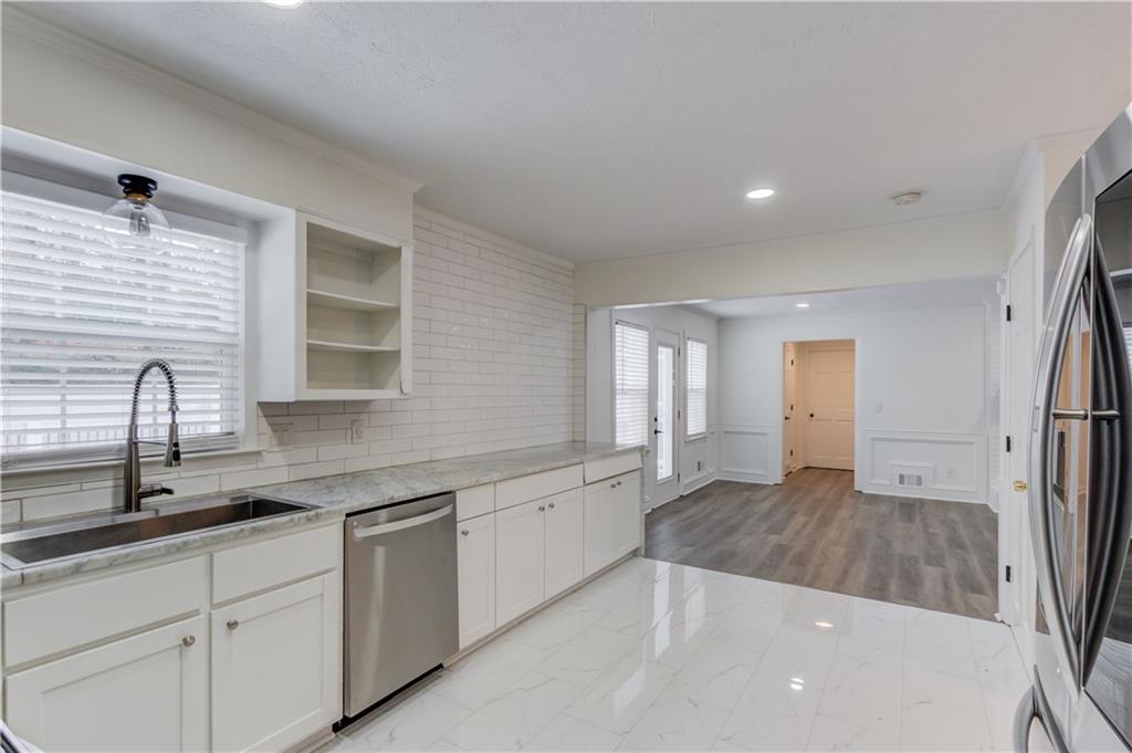 313 Summit Ridge Drive Lawrenceville, GA 30046 - Photo 15 of 42 a kitchen with a sink and cabinets