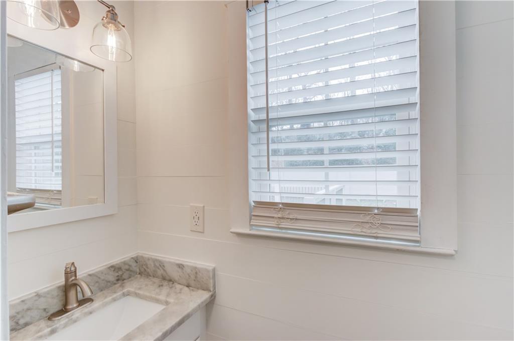 313 Summit Ridge Drive Lawrenceville, GA 30046 - Photo 16 of 42 a bathroom with a sink and a mirror