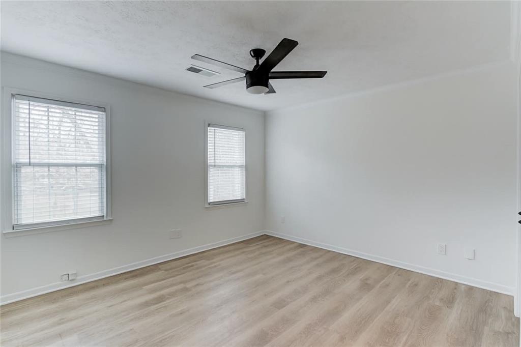 313 Summit Ridge Drive Lawrenceville, GA 30046 - Photo 25 of 42 wooden floor in an empty room with a window