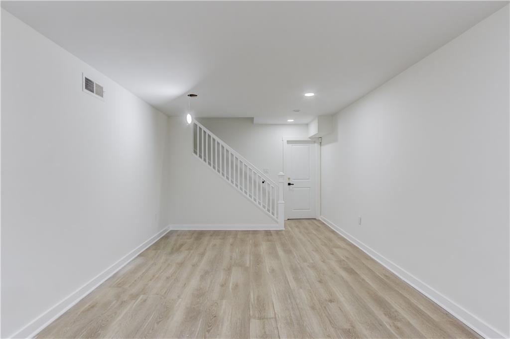 313 Summit Ridge Drive Lawrenceville, GA 30046 - Photo 30 of 42 a view of empty room with wooden floor