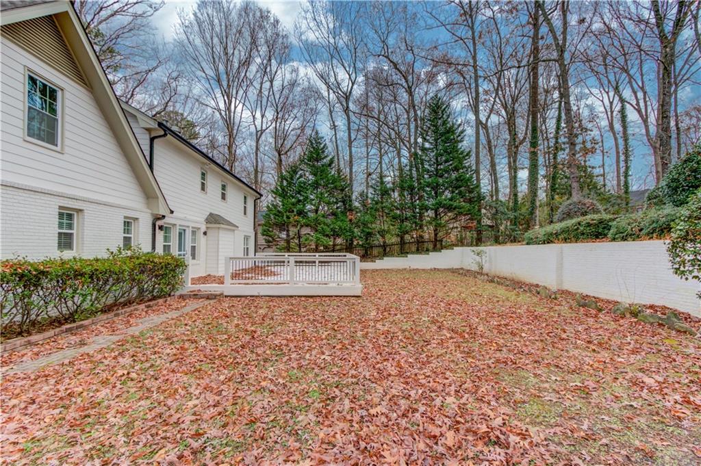313 Summit Ridge Drive Lawrenceville, GA 30046 - Photo 36 of 42 a white house that has a tree in front of it