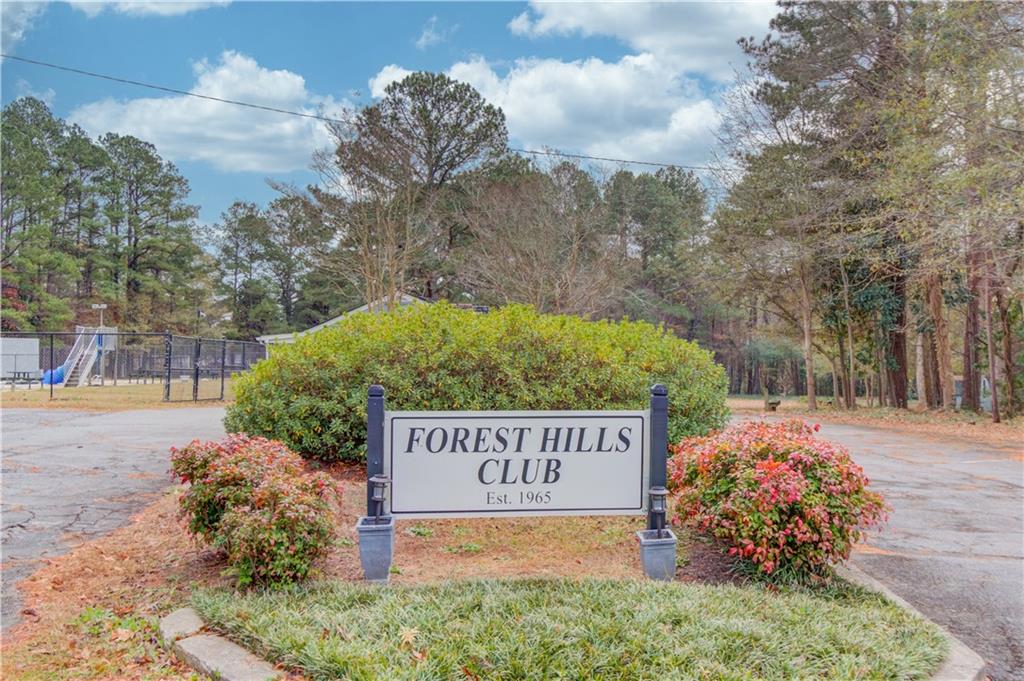 313 Summit Ridge Drive Lawrenceville, GA 30046 - Photo 39 of 42 a sign that is sitting on a brick wall