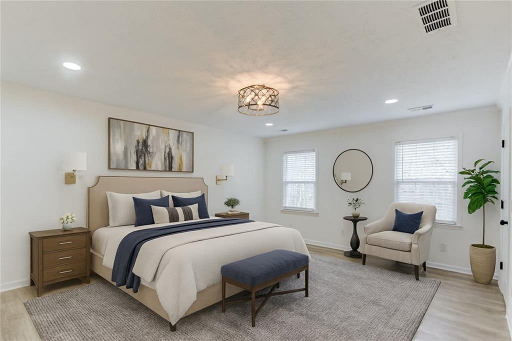 313 Summit Ridge Drive Lawrenceville, GA 30046 - Photo 4 of 42 a bedroom with bed and a chandelier