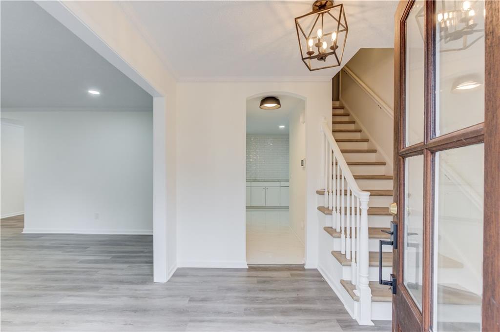 313 Summit Ridge Drive Lawrenceville, GA 30046 - Photo 6 of 42 a view of entryway with wooden floor