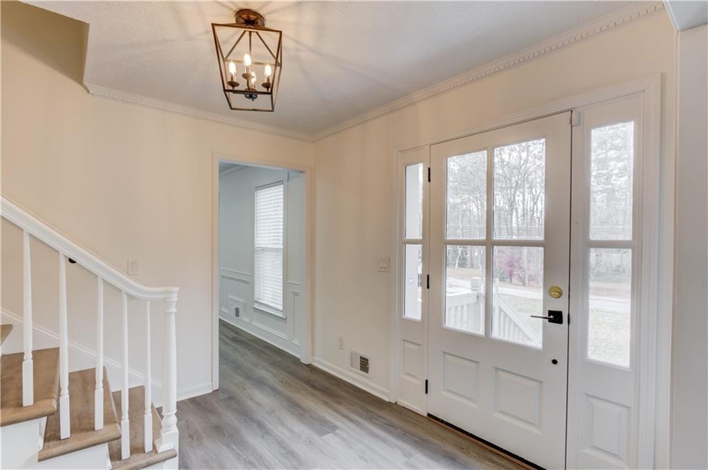 313 Summit Ridge Drive Lawrenceville, GA 30046 - Photo 7 of 42 a view of an entryway with wooden floor