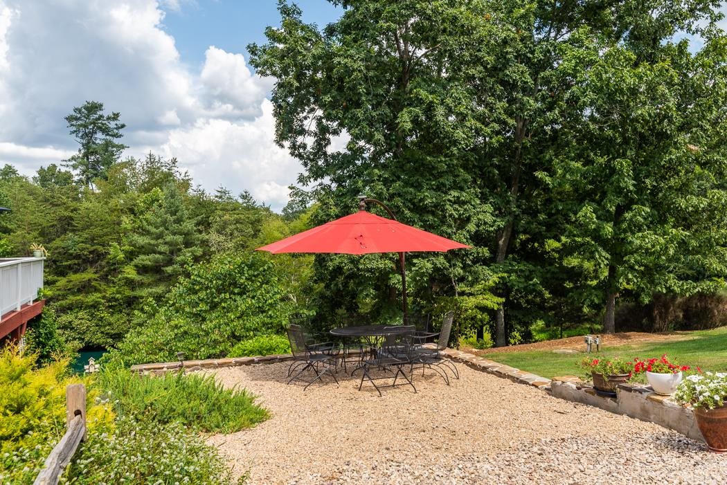170 Old Back Road Raphine, VA 24472 - Photo 25 of 66 a view of a backyard with a patio and plants
