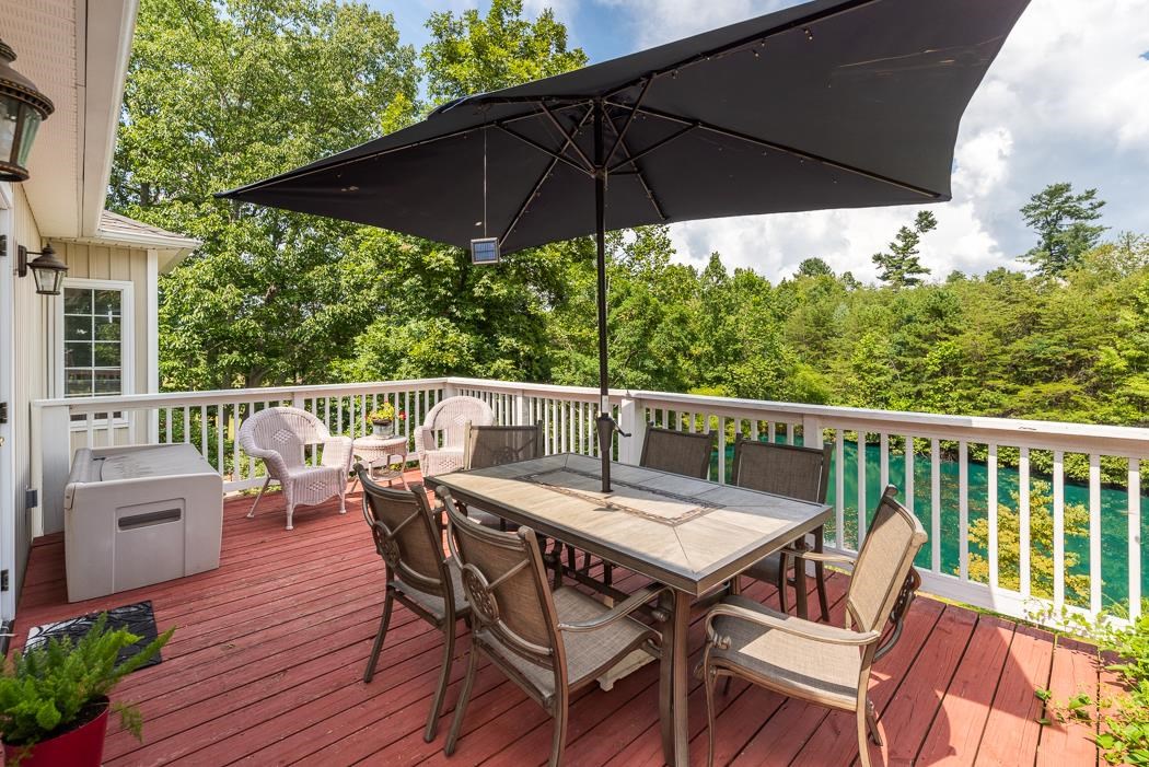 170 Old Back Road Raphine, VA 24472 - Photo 51 of 66 a view of balcony with furniture and umbrella