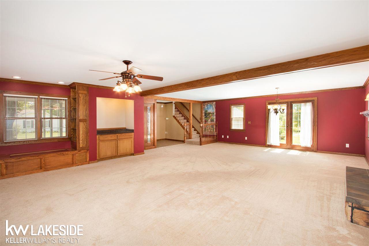 34344 Armada Ridge Road Richmond, MI 48062 - Photo 17 of 36 This view showcases the built in shelves, bar area, and sitting area. This was shot from the part of the room that would be used as a living room.