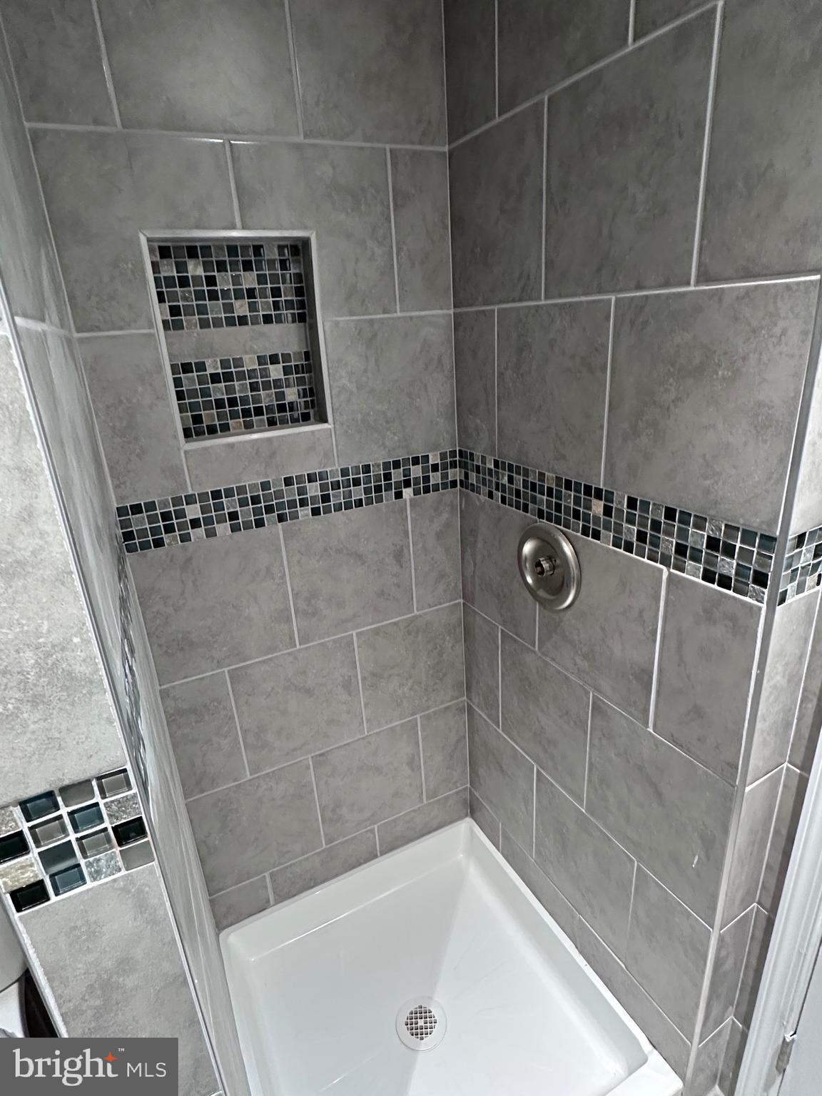5254 Jefferson Street Philadelphia, PA 19131 - Photo 12 of 30 a bathroom with a bathtub and a shower