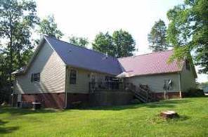 6115 Sharon Road Salisbury, NC 28147 - Photo 2 of 8 a front view of a house with a garden and deck
