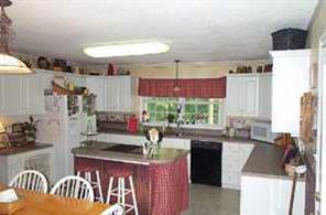 6115 Sharon Road Salisbury, NC 28147 - Photo 4 of 8 a kitchen with sink refrigerator and stove