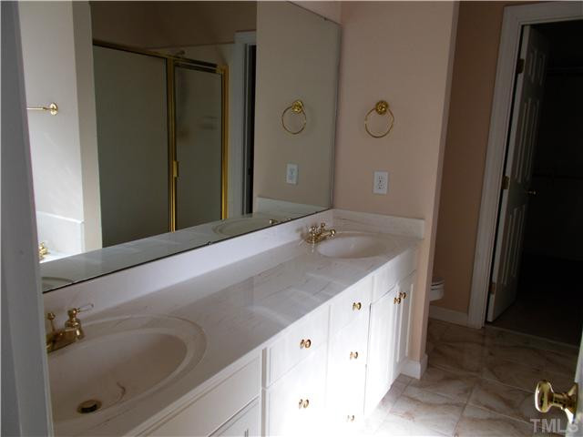 8417 Wycombe Ridge Way Wake Forest, NC 27587 - Photo 12 of 25 Glamour master bath with dual vanities, jetted tub, and separate shower. Opens to large walk-in closet. Master Bath/Spa