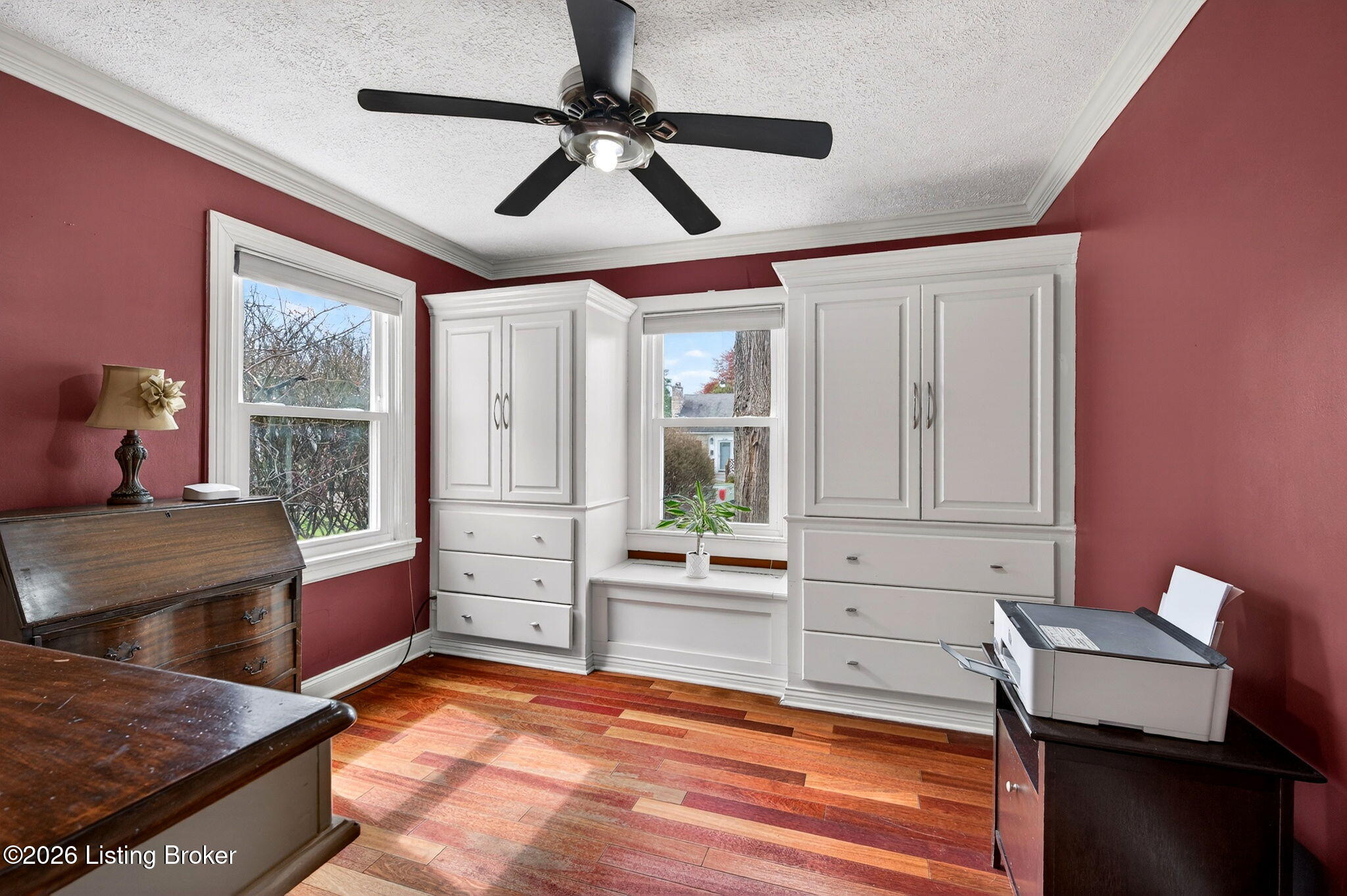 3101 Bobolink Road Louisville, KY 40213 - Photo 21 of 57 Bedroom one offers a ceiling fan and impressive built-in cabinetry with drawers flanking a center window
