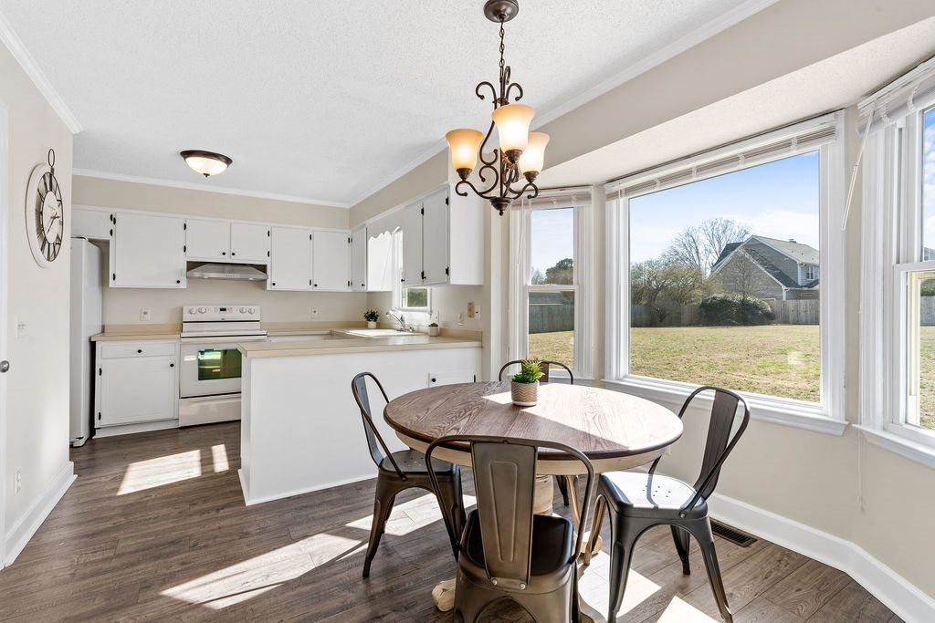 1605 Habbot Drive Raleigh, NC 27603 - Photo 8 of 30 Breakfast Area with Bay Window that has a Grid-Less Pane for Better Views