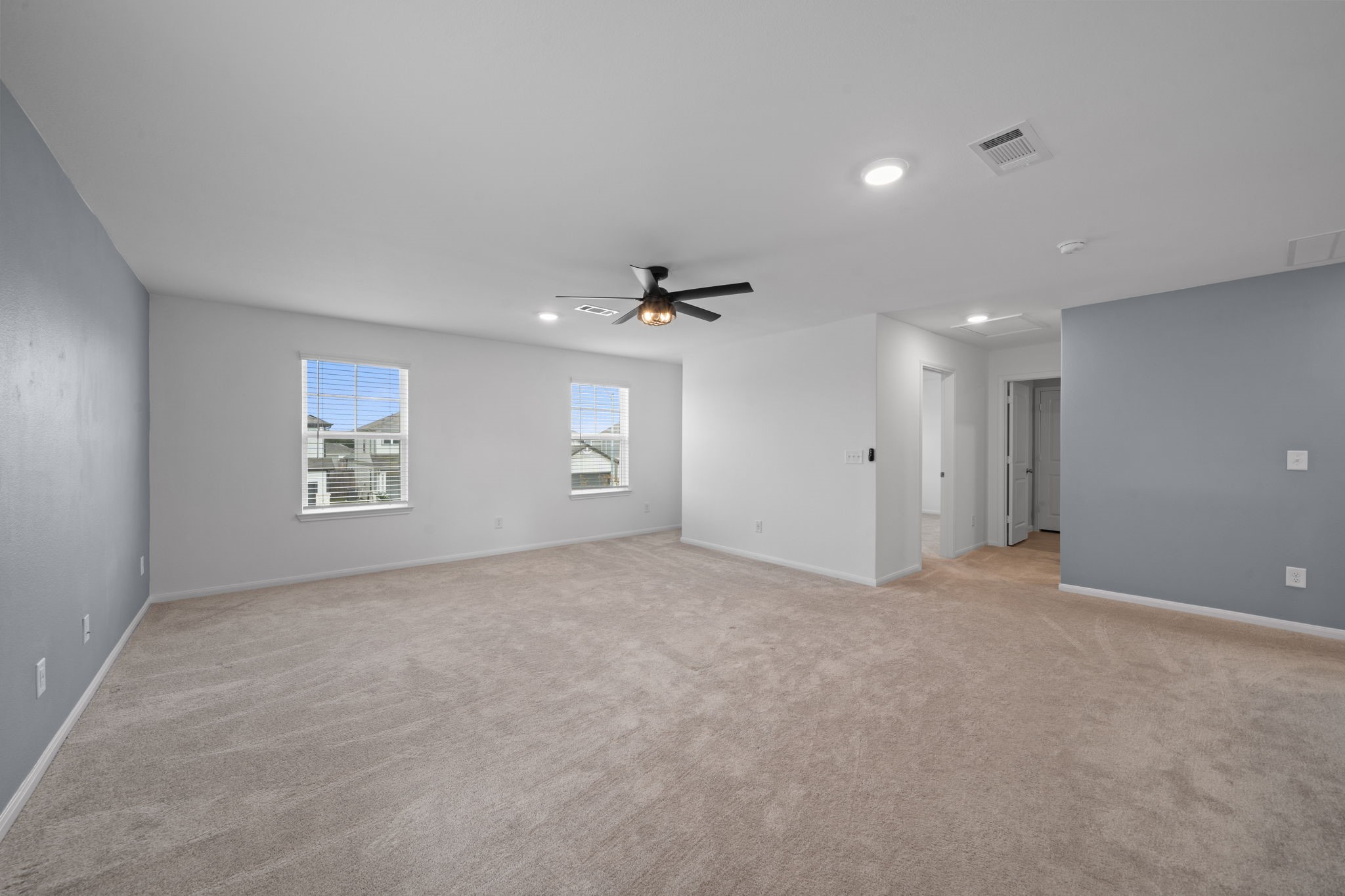 23515 Weir Box Road Hockley, TX 77447 - Photo 10 of 24 an empty room with a empty space and windows