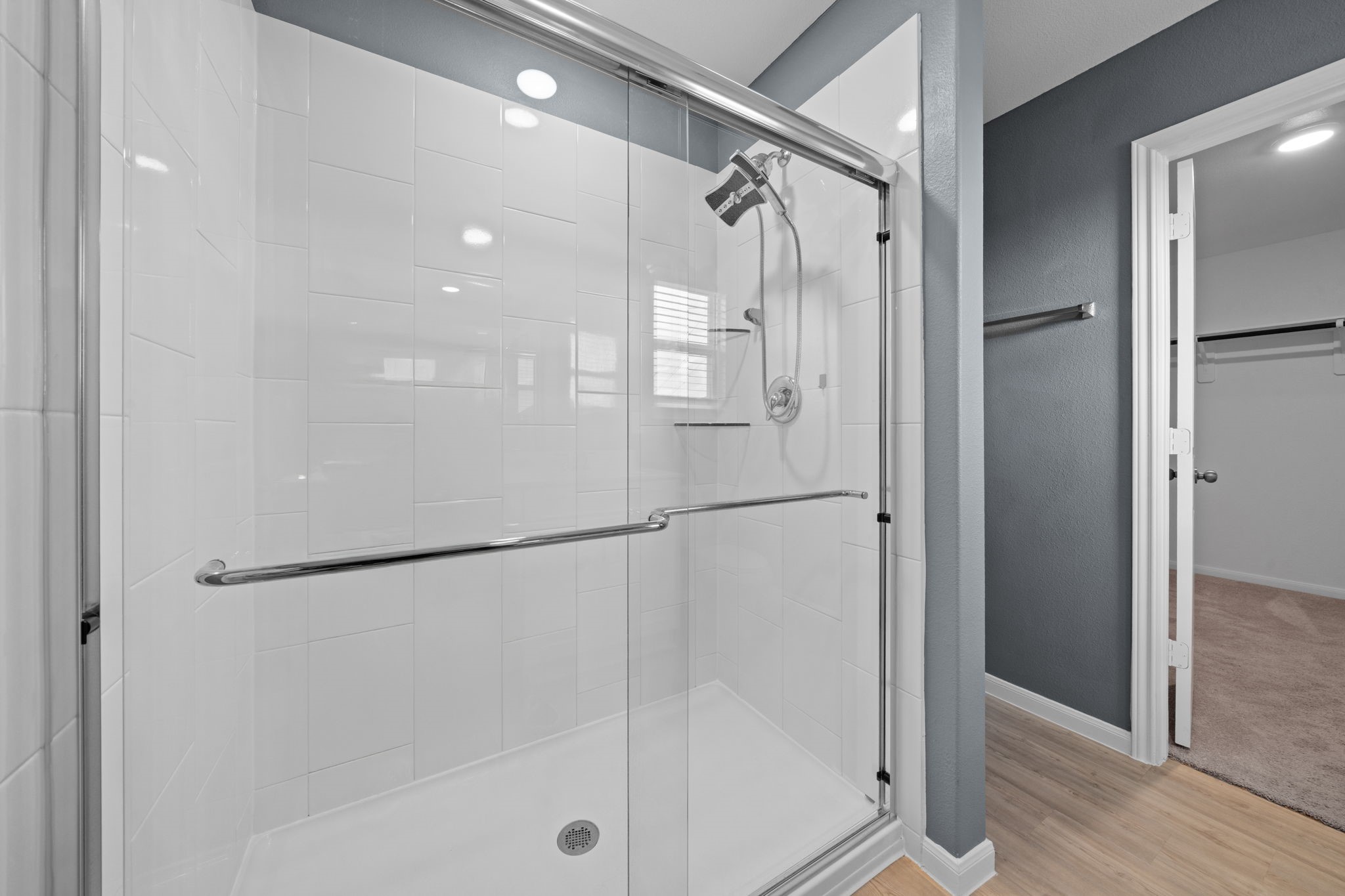 23515 Weir Box Road Hockley, TX 77447 - Photo 14 of 24 a bathroom with a shower and a glass door