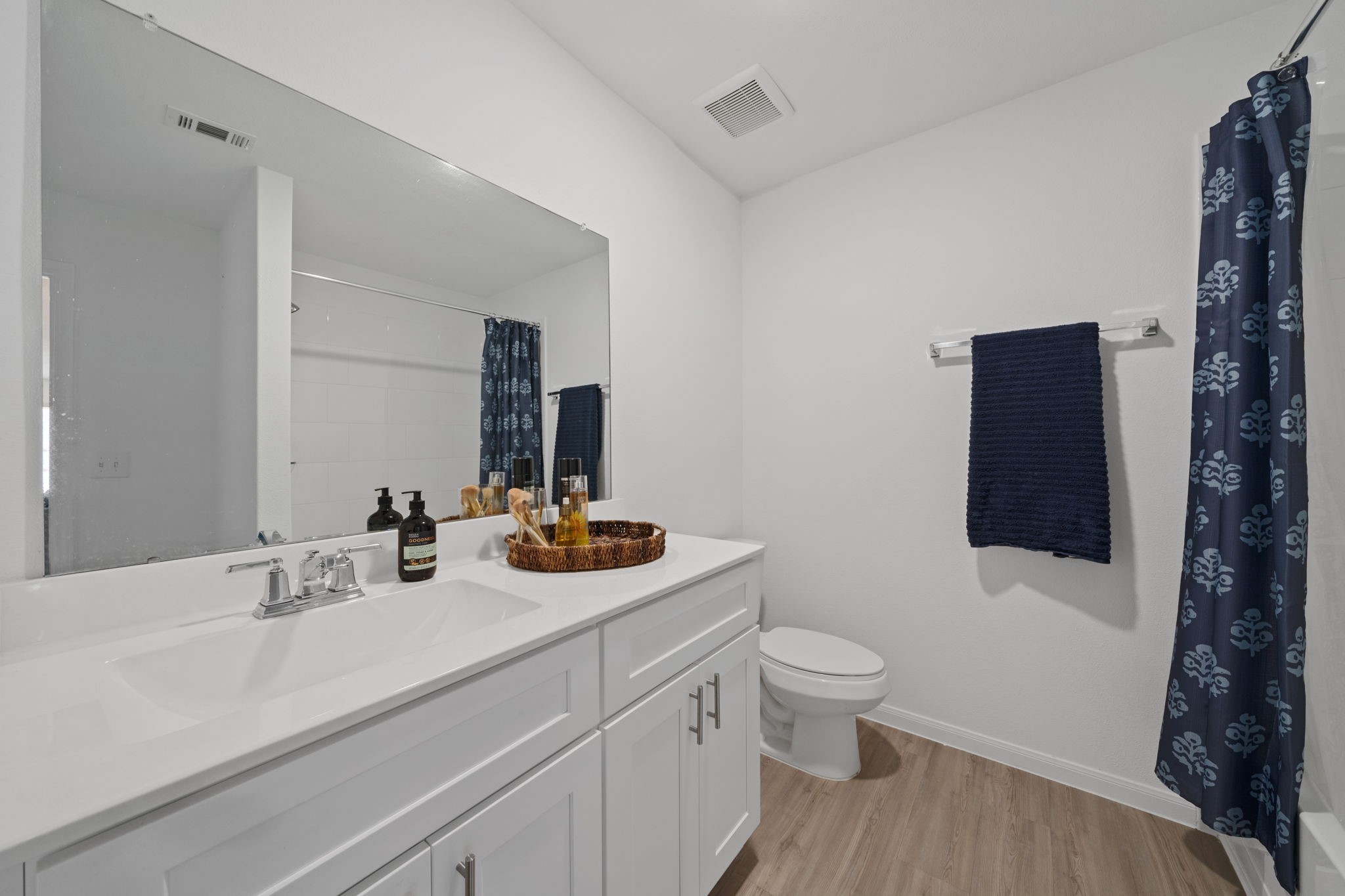 23515 Weir Box Road Hockley, TX 77447 - Photo 17 of 24 a bathroom with a sink a toilet and shower curtain