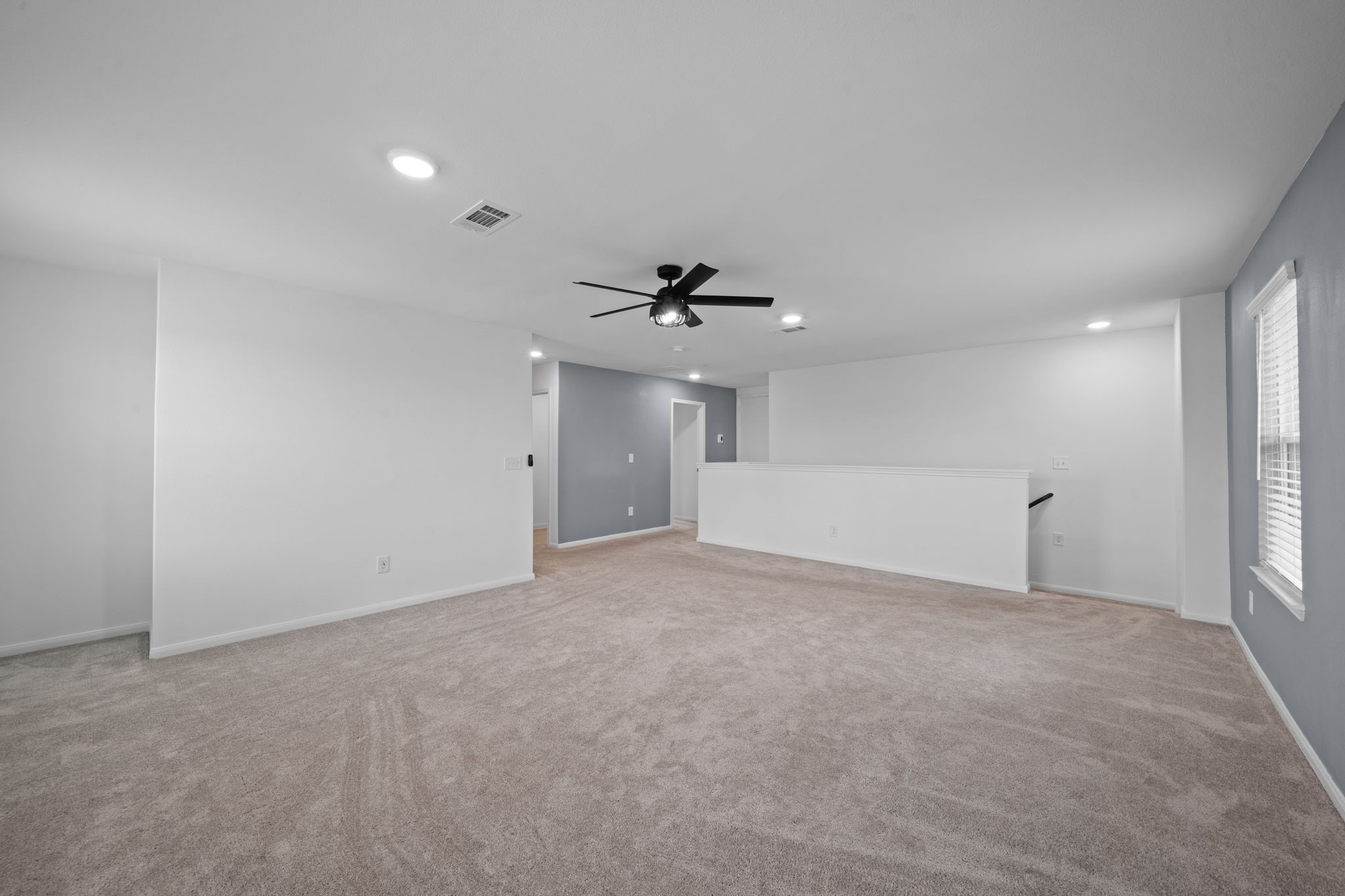 23515 Weir Box Road Hockley, TX 77447 - Photo 9 of 24 a view of an empty room with a ceiling fan