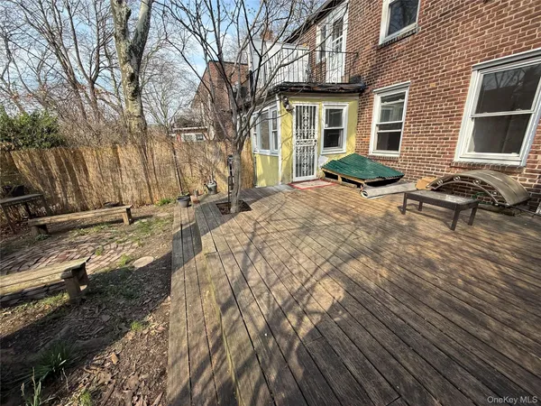 a view of a backyard with sitting area