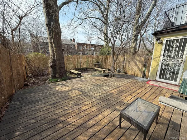 a view of a wooden deck with a bench